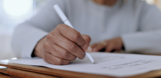 Women signing a document