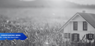a black and white photo of a house with a blue key shaped logo with 'national conveyancing week 2024' written inside