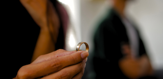 Woman taking her wedding ring off