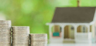 Coins and small house