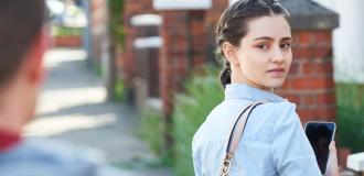 Man watching woman as she turns around