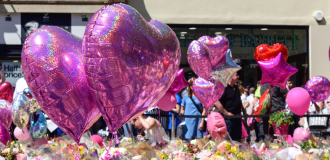heart balloons and flowers at manchester arena attack memorial