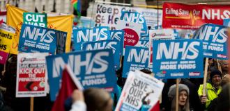 crowd of people protesting to save NHS