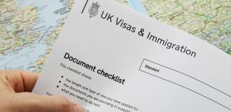 immigration application document over a world map