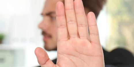 Man showing his hand in the action of 'stop'