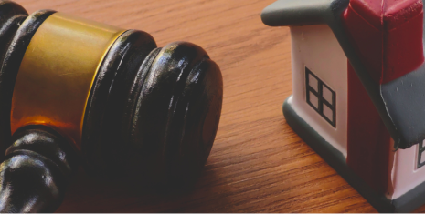 Gavel and miniature house