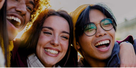 Young people who are friends embracing each other