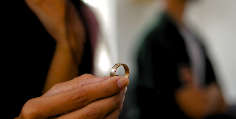Woman taking her wedding ring off