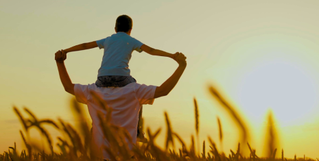 Child on fathers shoulders