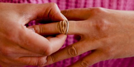 Woman taking ring off