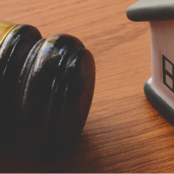 Gavel and miniature house